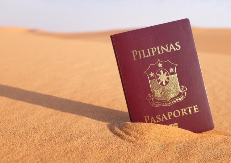 Philippine passport in a desert