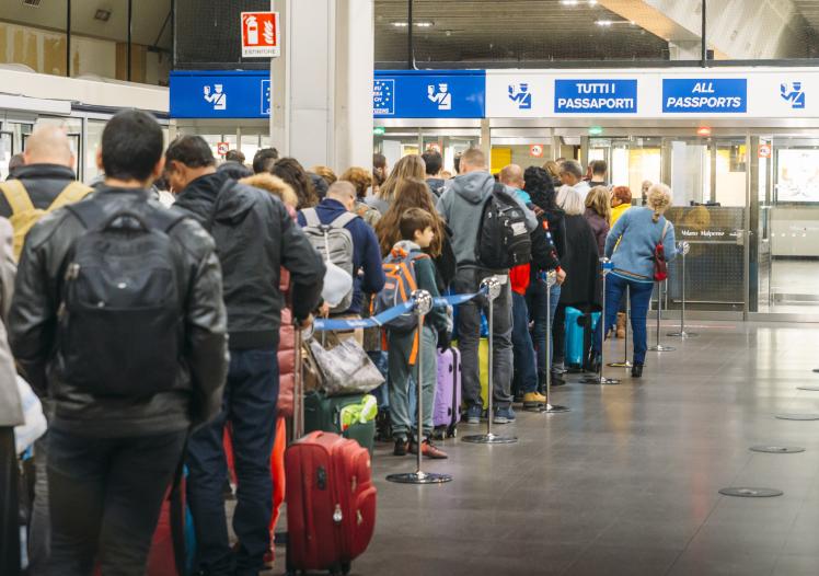 Long immigration queue at Malpensa Airport in Milan, Italy for arrivals of Non-Schengen travellers 