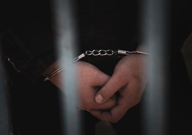 Handcuffed prisoner