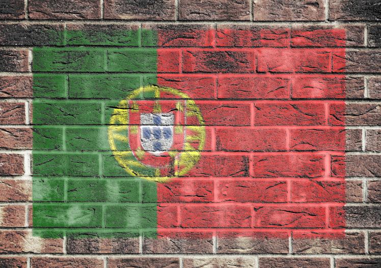 Portugal flag on old brick wall
