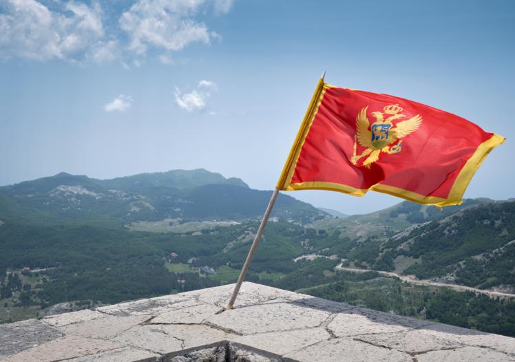 Montenegro Flag Waving in the Mountains of Lovcen
