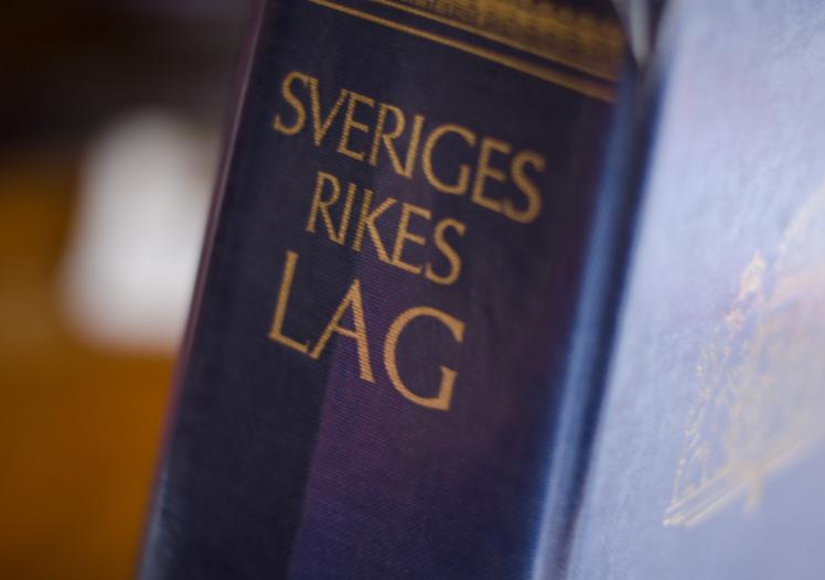 The collected laws of Sweden in a blue book in close-up