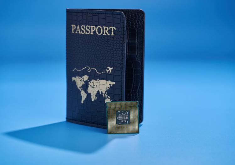 Passport with world map and computer chip