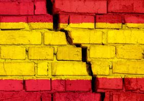 Spanish flag on brick wall