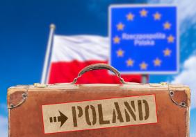 Polish flag, a suitcase and destination Poland 