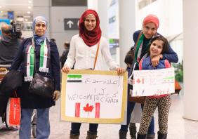Syrian refugees arrive at Toronto's Pearson International Airport in 2011