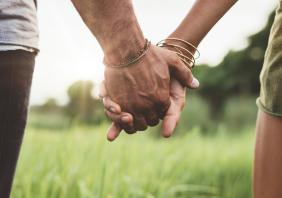 Young couple holding hands