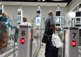 Air Travellers Pass through Automated Border Control at an Airport 