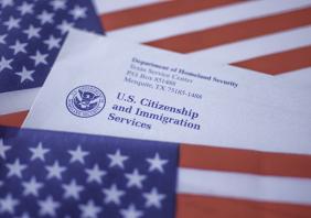 Letter (Envelope) from USCIS covered in flag of USA on American colors background