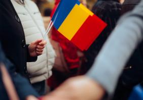 People Waving Flags at the Great Union Day parade in Romania