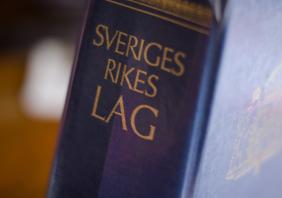 The collected laws of Sweden in a blue book in close-up