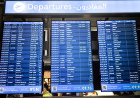 Digital Flight Departure Board at Dubai International Airport Terminal