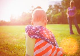 Baby wrapped in American flag