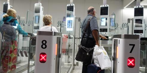 Air Travellers Pass through Automated Border Control at an Airport 