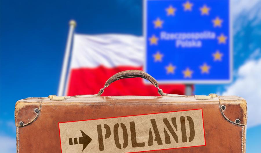 Polish flag, a suitcase and destination Poland 