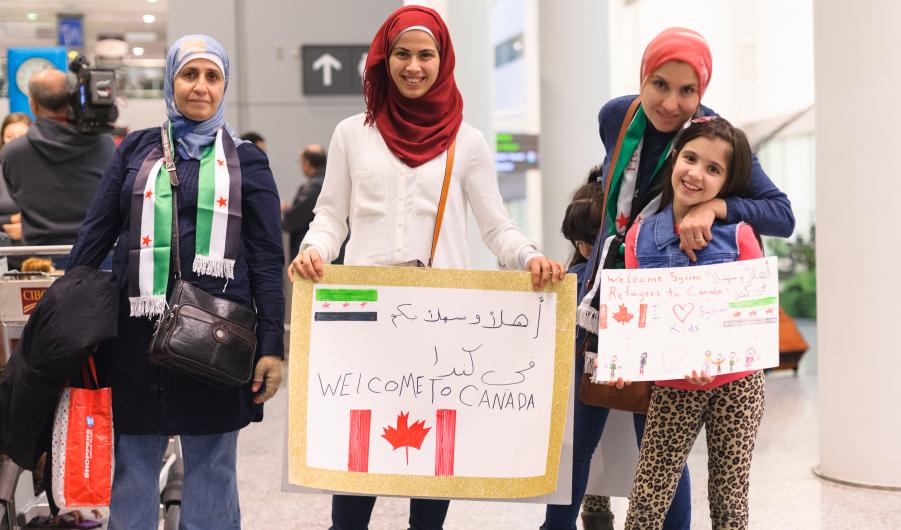 Syrian refugees arrive at Toronto's Pearson International Airport in 2011