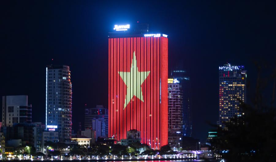Vietnamese flag led wall is bright in one of building in Danang