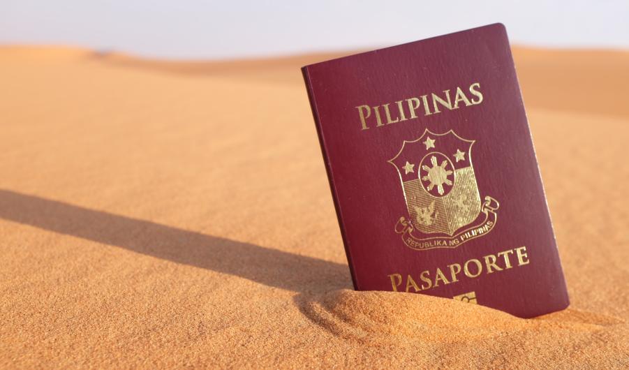 Philippine passport in a desert