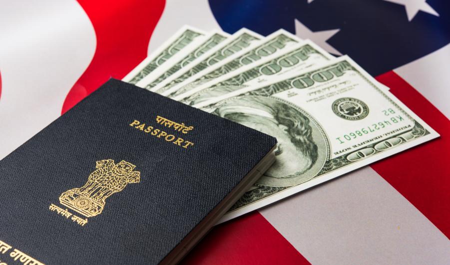 Indian passport with US currency notes 
