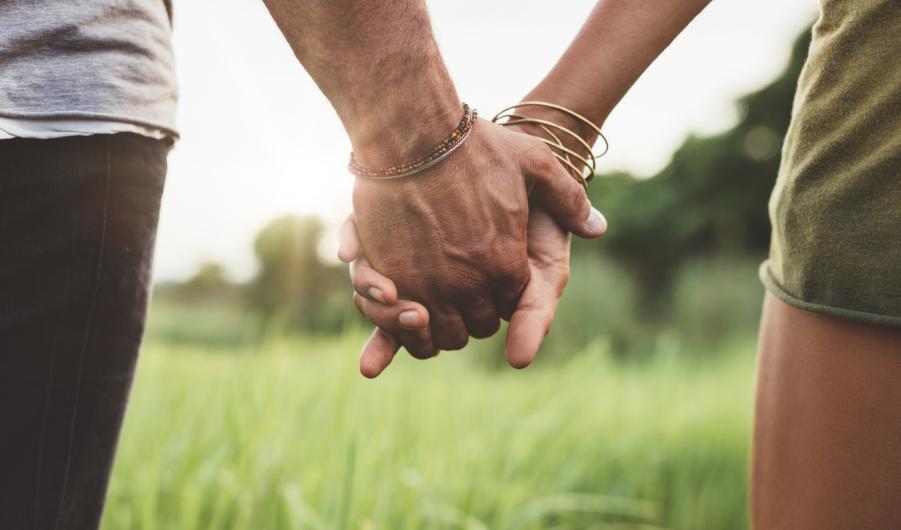 Young couple holding hands