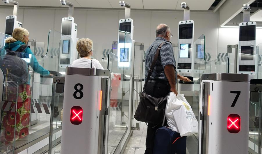 Air Travellers Pass through Automated Border Control at an Airport 