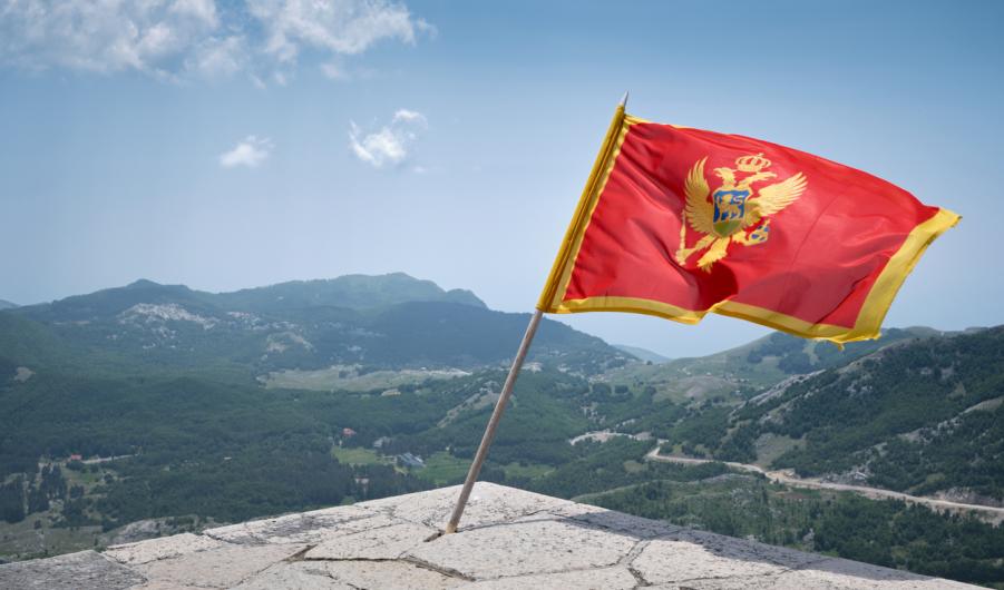 Montenegro Flag Waving in the Mountains of Lovcen