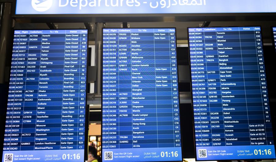 Digital Flight Departure Board at Dubai International Airport Terminal