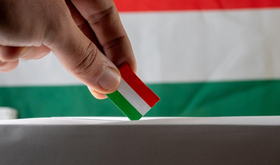 Hungarian flag going into a ballot box