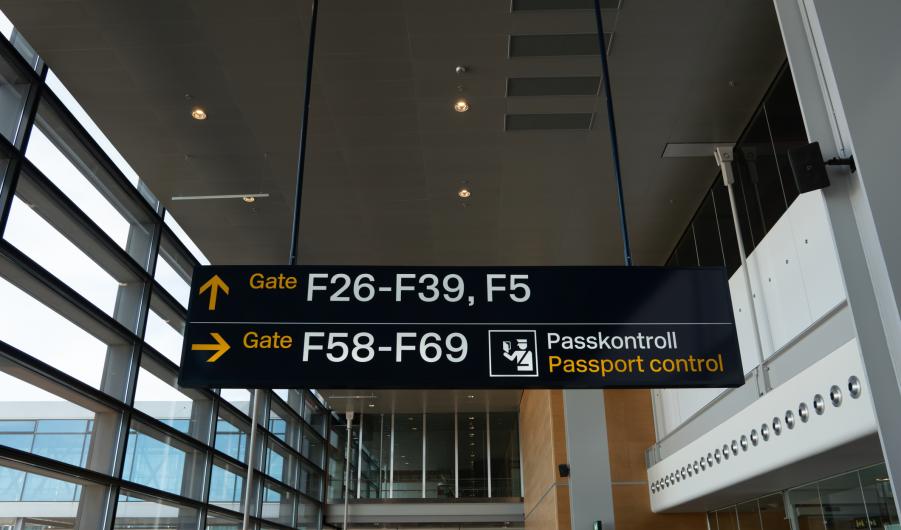 Passport control and customs sign at a Swedish airport